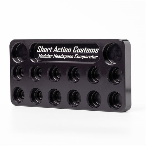 The SHORT ACTION CUSTOMS Headspace Comparator Stand allows easy comparison of resized brass to your barrel's headspace, featuring slots for Master Headspace Brass.