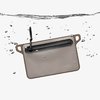 The MAGPUL DAKA Waterproof Window Pouch features a 100% waterproof YKK zipper, durable 550 paracord pulls, and a translucent window for easy content identification.
